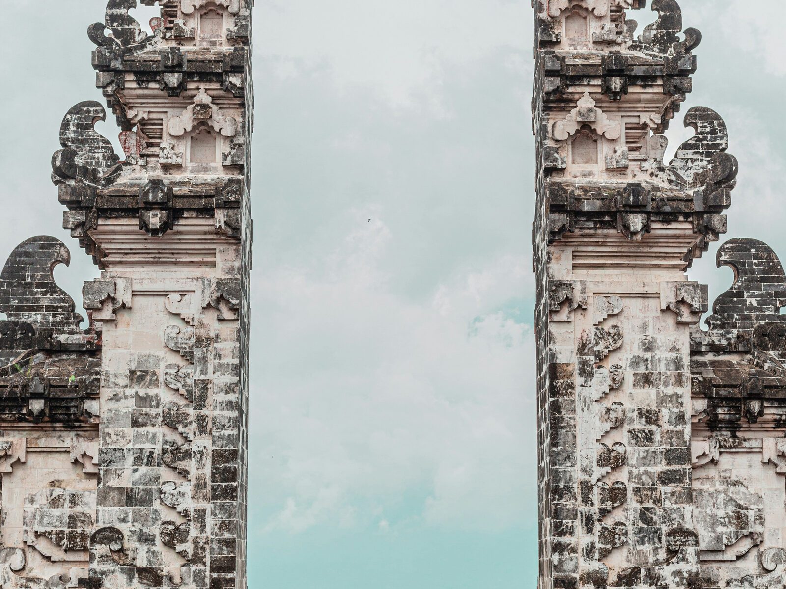 Carved Balinese temple gate framing the sky