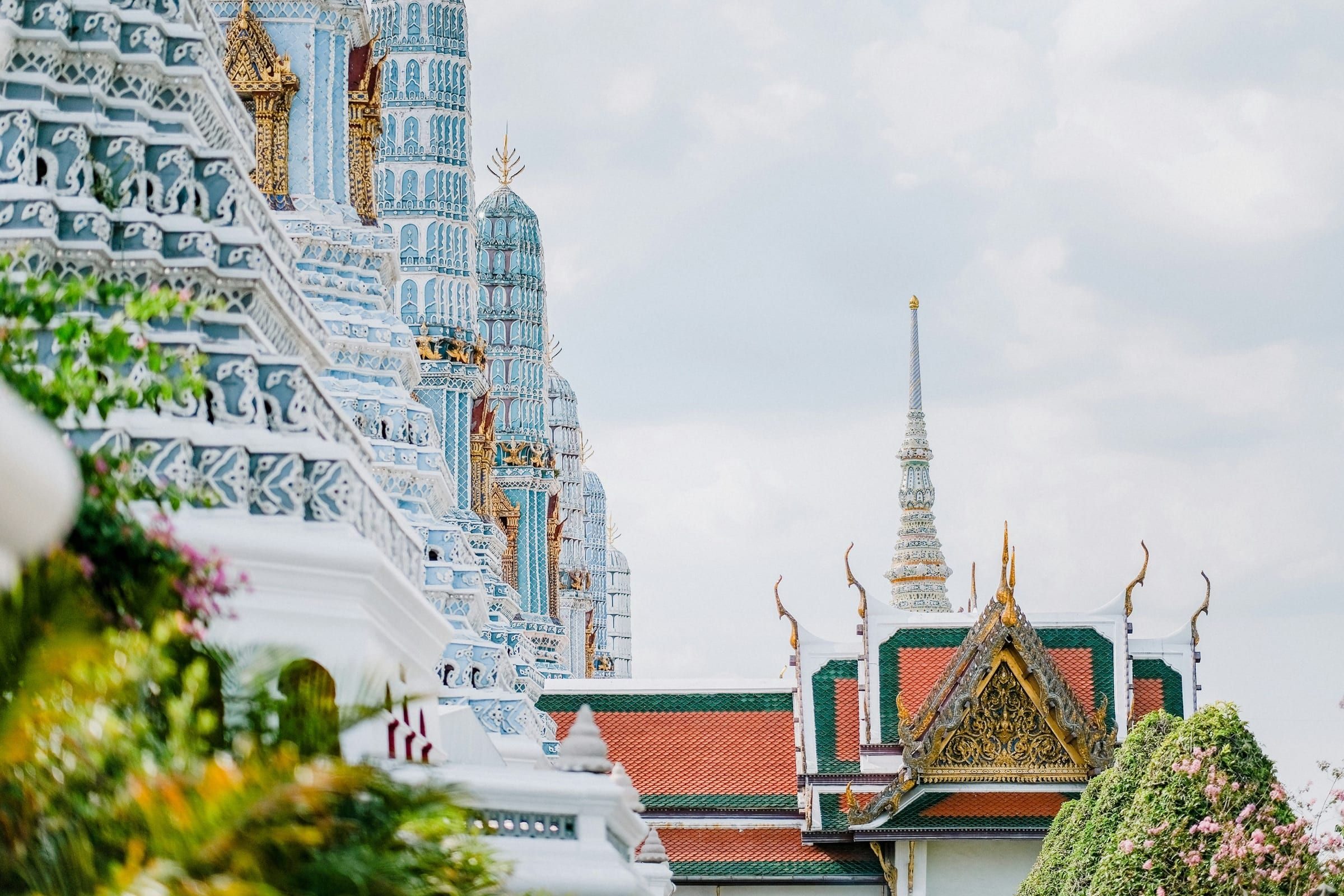 Ornate spires and tiled roofs of a Bangkok temple
