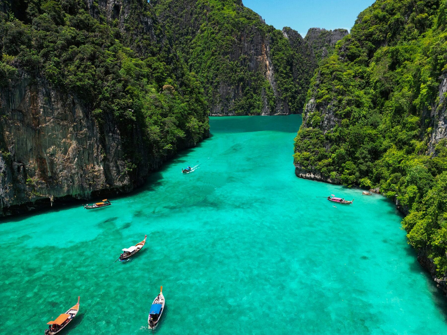 Turquoise lagoon between limestone cliffs near Phuket