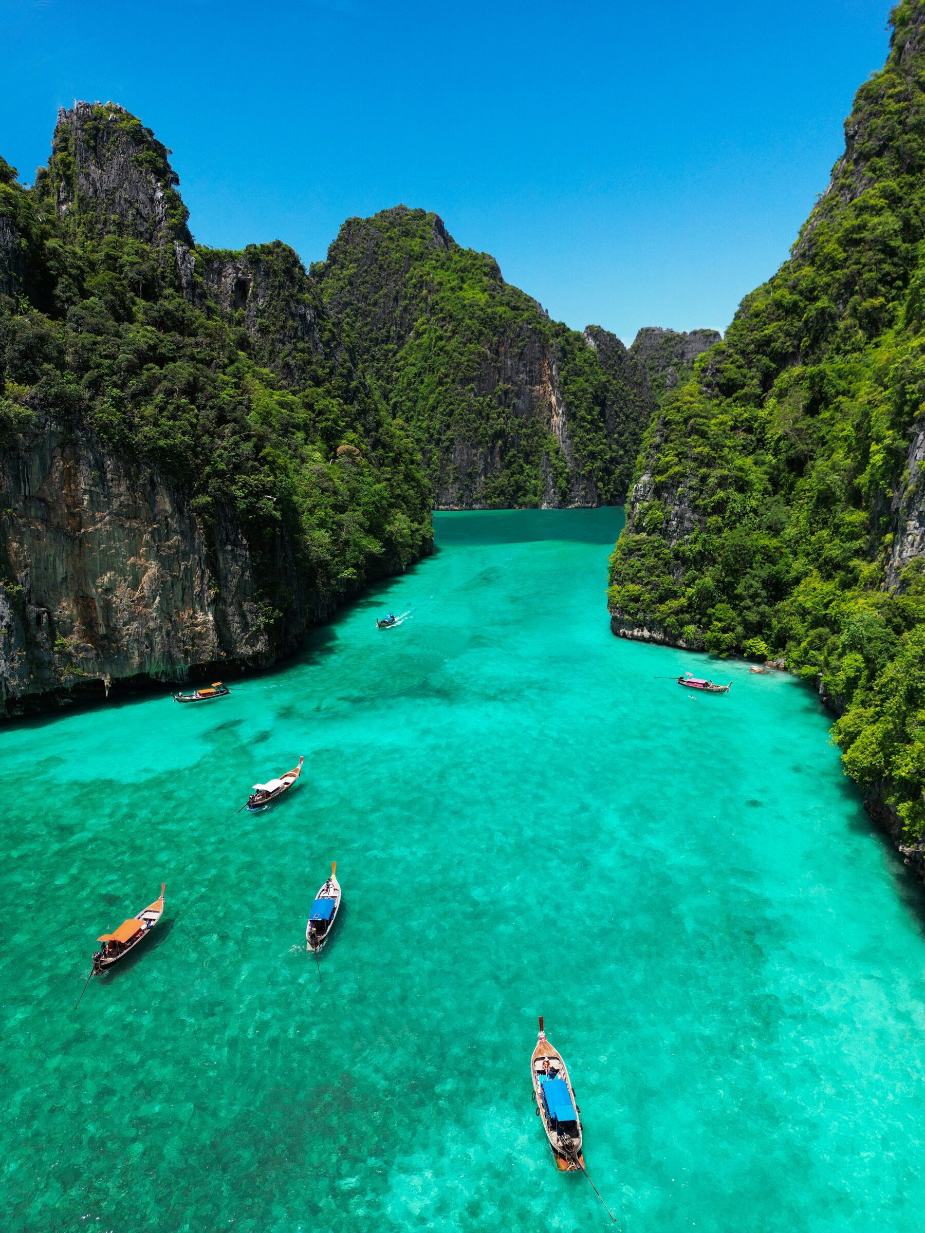 Turquoise lagoon between limestone cliffs near Phuket